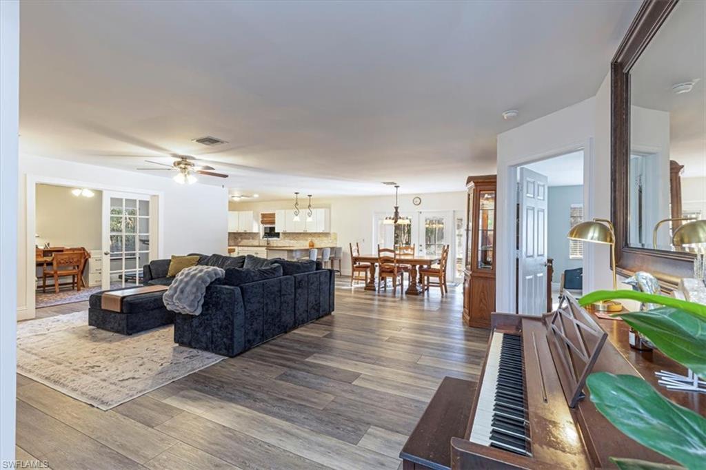 960 21st Street Southwest Naples, FL 34117 - Photo 6 of 33 a living room with furniture fireplace and wooden floor