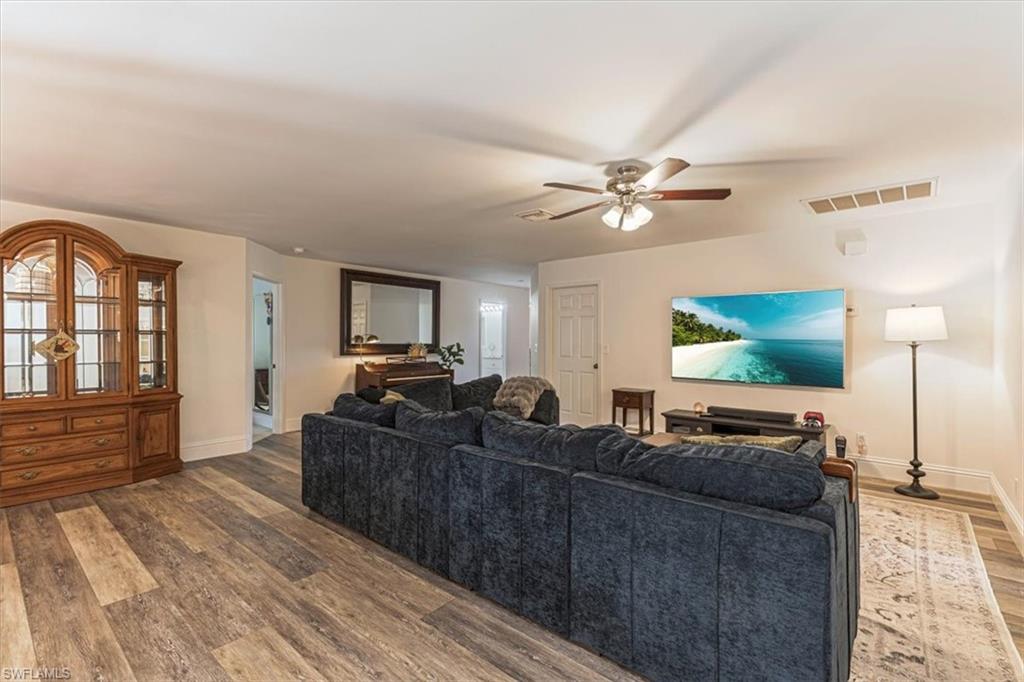 960 21st Street Southwest Naples, FL 34117 - Photo 8 of 33 a living room with furniture and a flat screen tv