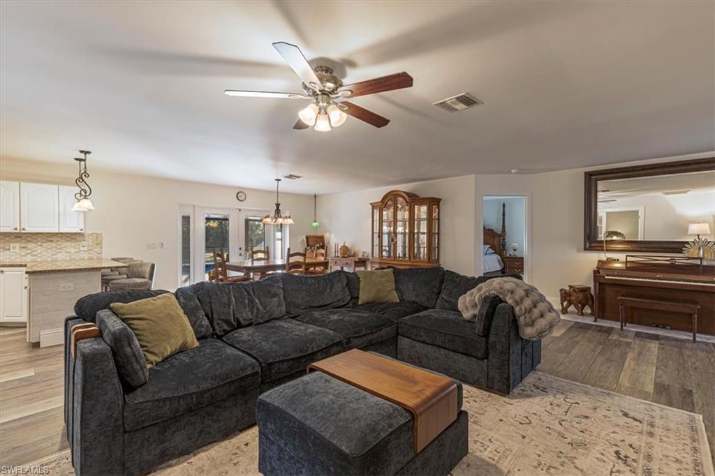 960 21st Street Southwest Naples, FL 34117 - Photo 9 of 33 a living room with furniture and a fireplace