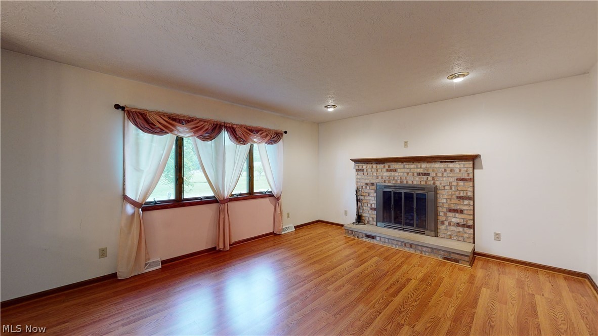4261 Industry Road Rootstown, OH 44272 - Photo 4 of 25 Formal Living room features Fireplace.