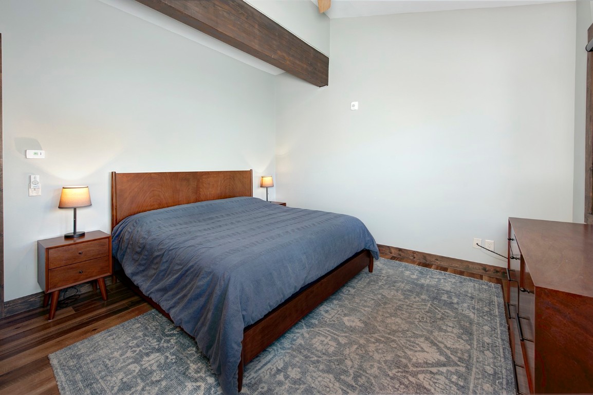 102 Lake Ridge Circle, Unit 1891 Keystone, CO 80435 - Photo 17 of 34 a bedroom with a bed and lamp