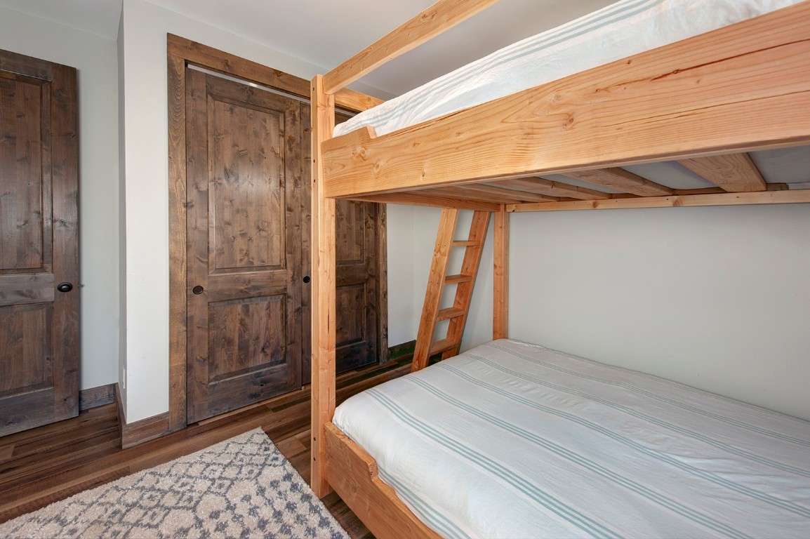 102 Lake Ridge Circle, Unit 1891 Keystone, CO 80435 - Photo 21 of 34 a bedroom with a bed and a window
