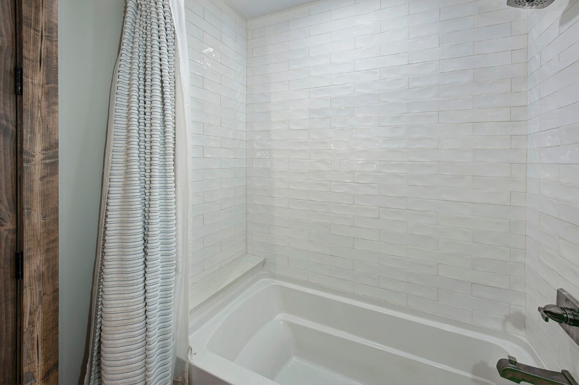 102 Lake Ridge Circle, Unit 1891 Keystone, CO 80435 - Photo 23 of 34 a bathroom with a shower curtain and a bathtub