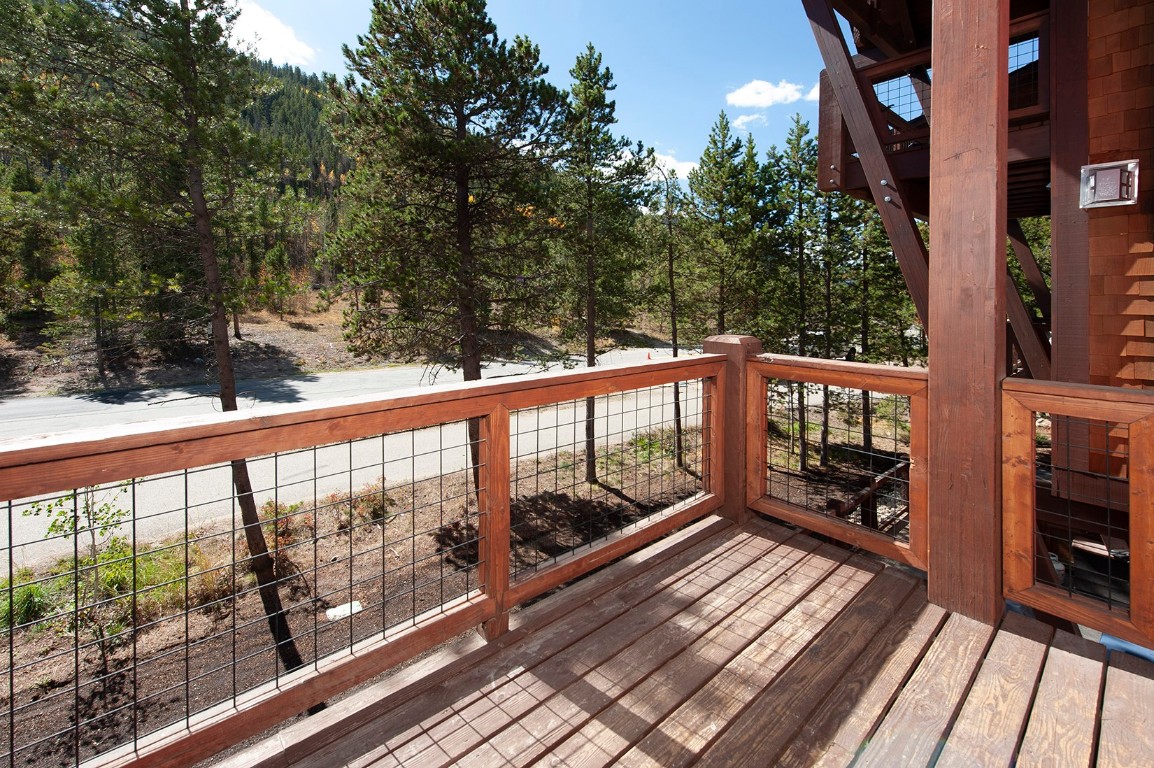 102 Lake Ridge Circle, Unit 1891 Keystone, CO 80435 - Photo 25 of 34 a view of a balcony with wooden floor