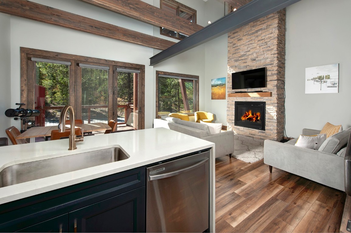 102 Lake Ridge Circle, Unit 1891 Keystone, CO 80435 - Photo 3 of 34 a kitchen with a sink and a fireplace