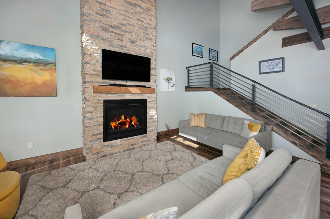 102 Lake Ridge Circle, Unit 1891 Keystone, CO 80435 - Photo 6 of 34 a living room with furniture and a fireplace