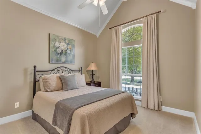 a bedroom with bed and a window