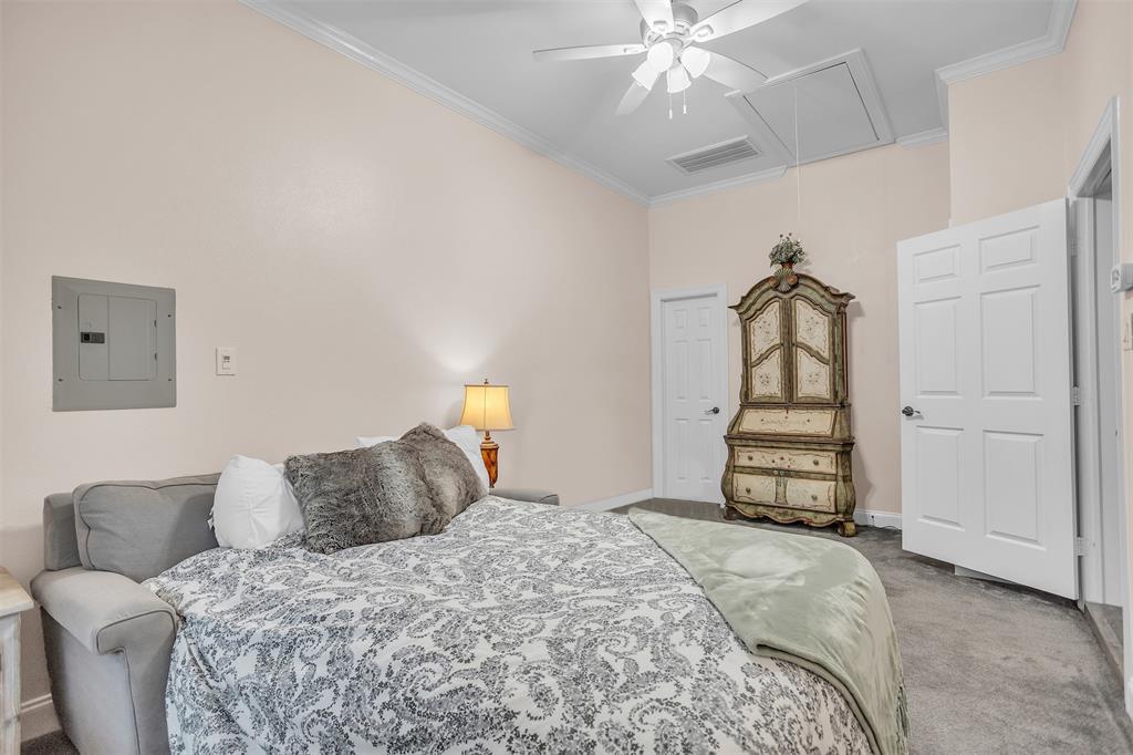 1 Darr Road Heath, TX 75032 - Photo 28 of 38 a bedroom with a bed and a chandelier