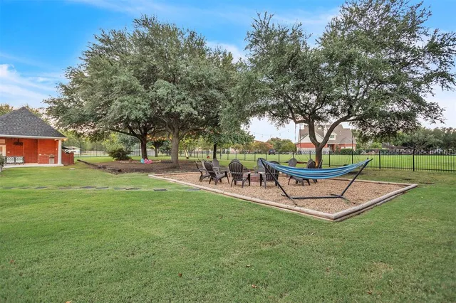 a view of a park with large trees