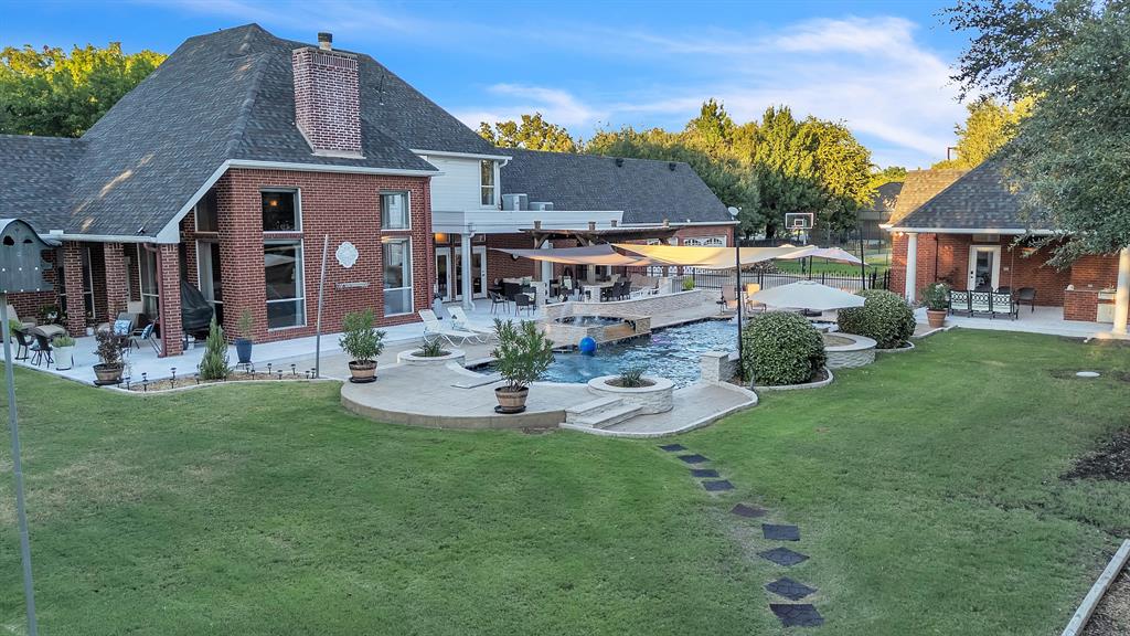 1 Darr Road Heath, TX 75032 - Photo 31 of 38 a front view of a house with garden and sitting area
