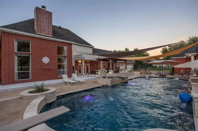 a front view of house with a garden