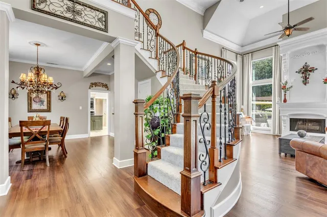 a view of living room filled with furniture and wooden floor