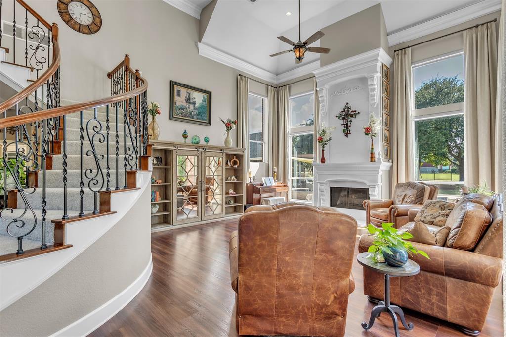 1 Darr Road Heath, TX 75032 - Photo 8 of 38 a living room with furniture a fireplace and a large window