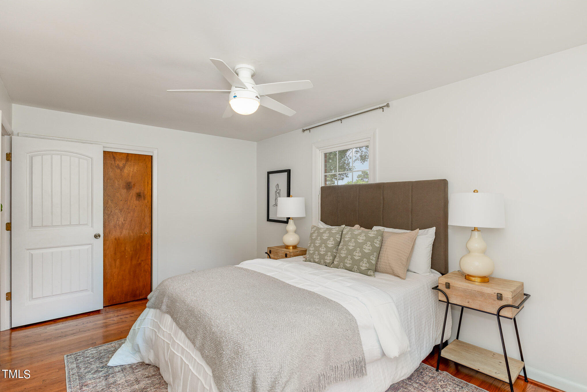 5125 Kaplan Drive Raleigh, NC 27606 - Photo 15 of 23 a bedroom with a bed and a chandelier