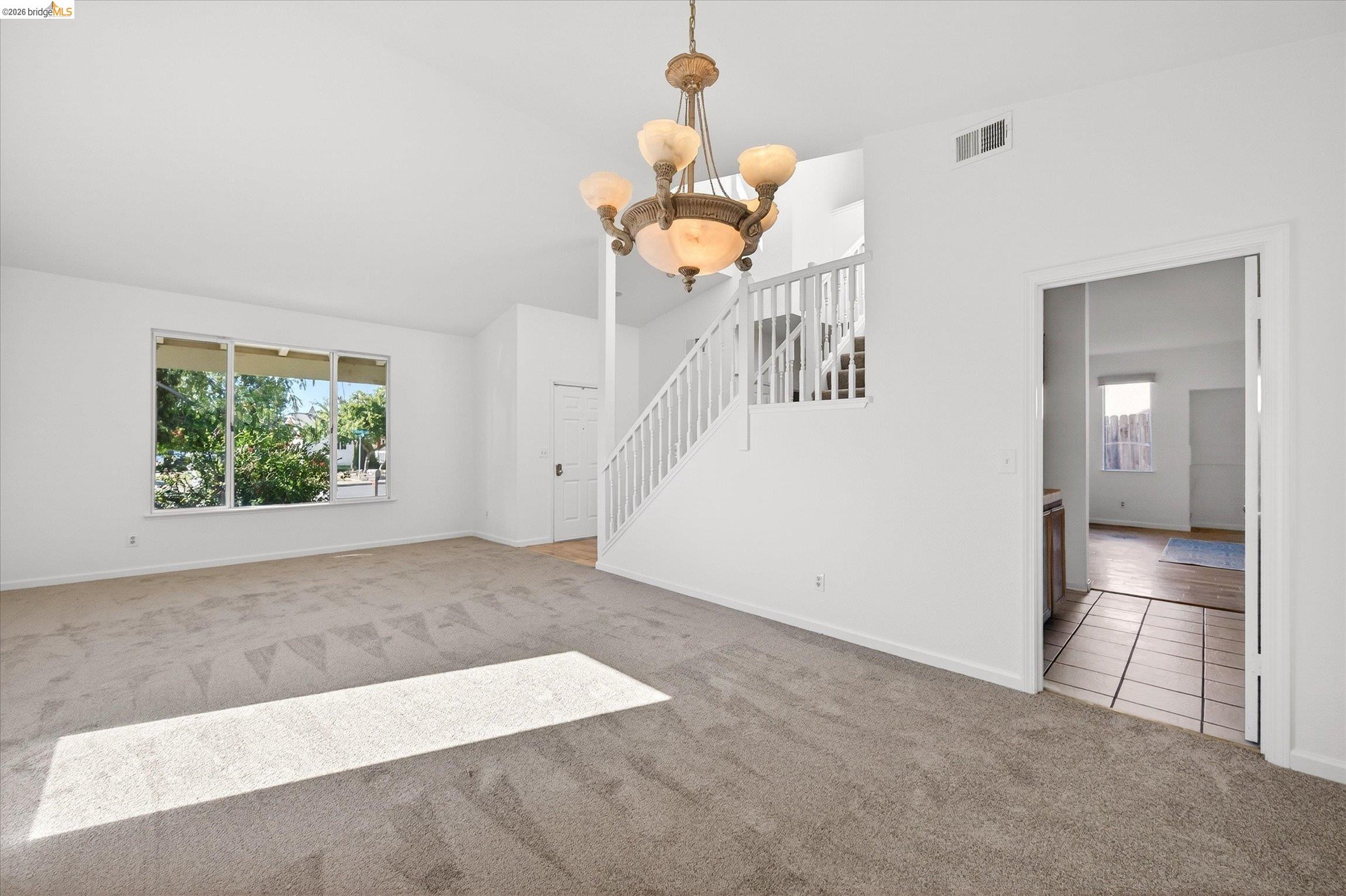 1120 Deerpark Road Oakley, CA 94561 - Photo 10 of 30 Spacious living area featuring neutral carpet and a multi-pane window