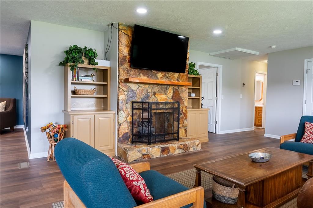 6938 Story Mill Road Hephzibah, GA 30815 - Photo 23 of 36 a living room with furniture and a flat screen tv