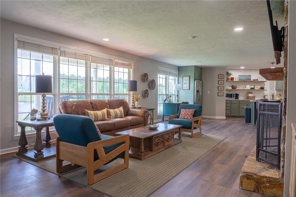 6938 Story Mill Road Hephzibah, GA 30815 - Photo 25 of 36 a living room with furniture and a large window