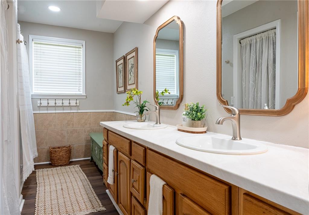6938 Story Mill Road Hephzibah, GA 30815 - Photo 28 of 36 a bathroom with a sink and a mirror