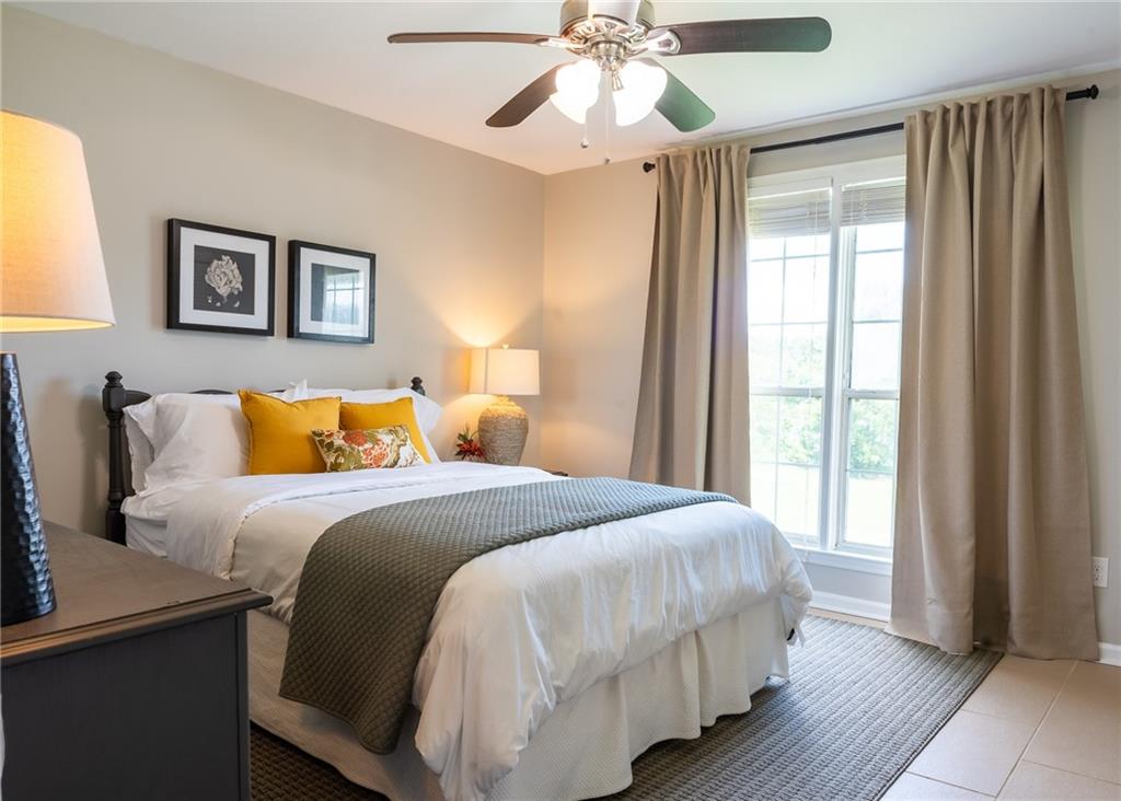 6938 Story Mill Road Hephzibah, GA 30815 - Photo 29 of 36 a bedroom with bed and wooden floor