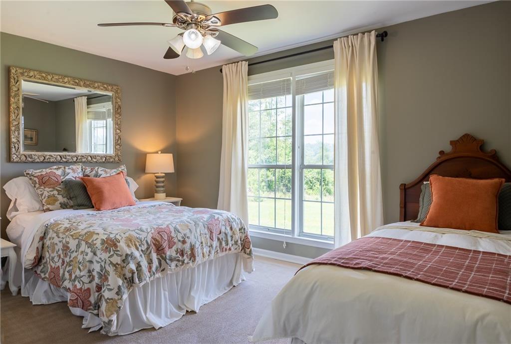 6938 Story Mill Road Hephzibah, GA 30815 - Photo 31 of 36 a bedroom with a bed and window