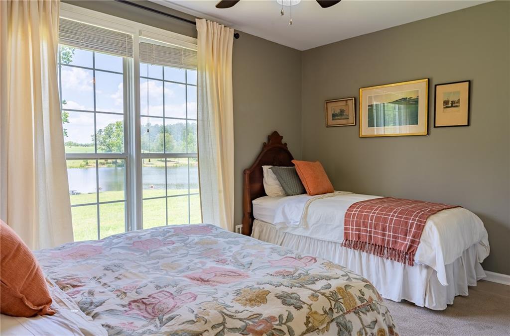 6938 Story Mill Road Hephzibah, GA 30815 - Photo 32 of 36 a bedroom with a bed and a large window