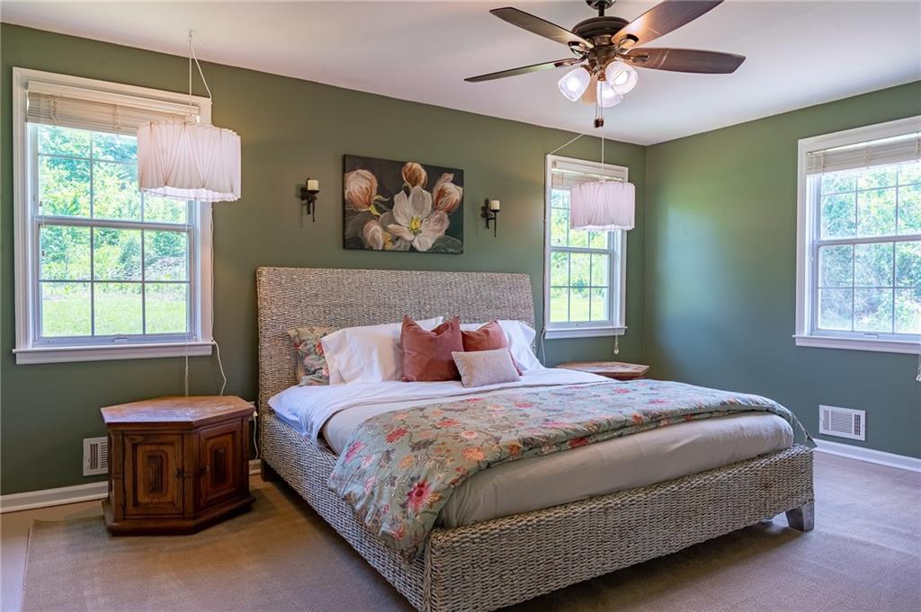 6938 Story Mill Road Hephzibah, GA 30815 - Photo 33 of 36 a bedroom with a bed and a window