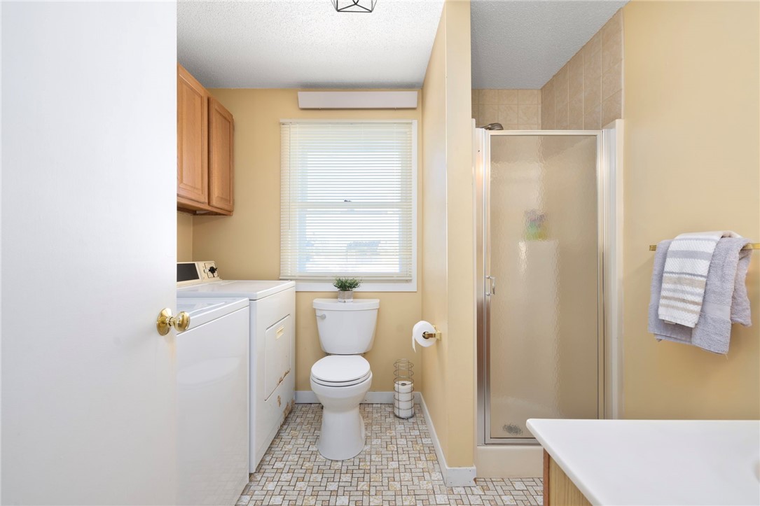 62 Flintstone Road Narragansett, RI 02882 - Photo 23 of 43 A full first floor bath with shower, tile floor, and vanity.