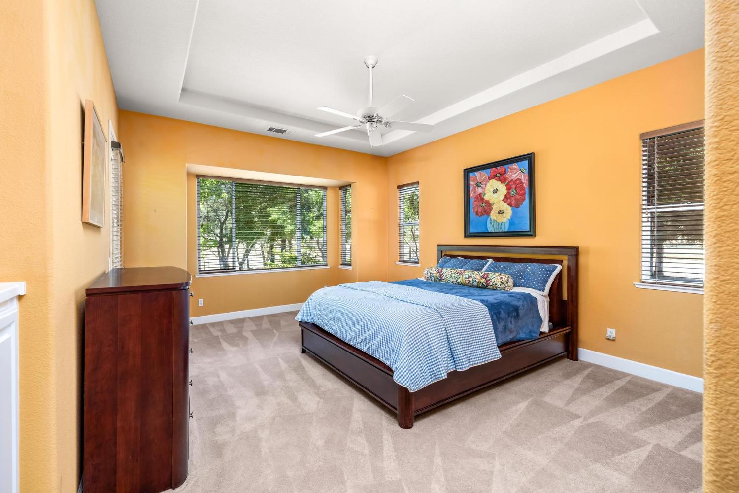 8 Rock Ridge Court, Unit 288 Copperopolis, CA 95228 - Photo 24 of 58 Wonderful spacious primary bedroom with a french door to the patio.