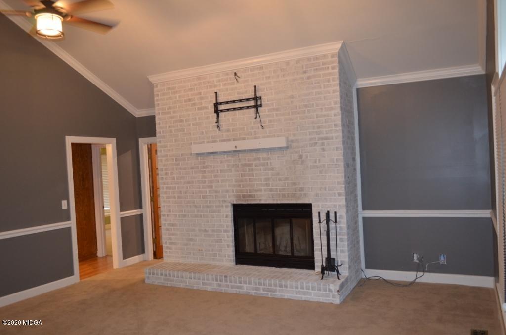 7690 Thomaston Road Macon, GA 31220 - Photo 8 of 28 a living room with a fireplace