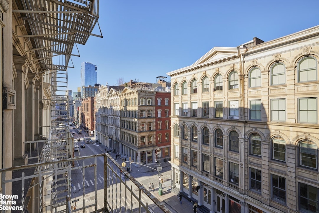 461 Broome Street, Unit 4 Manhattan, NY 10013 - Photo 12 of 14 a front view of a building with glass door