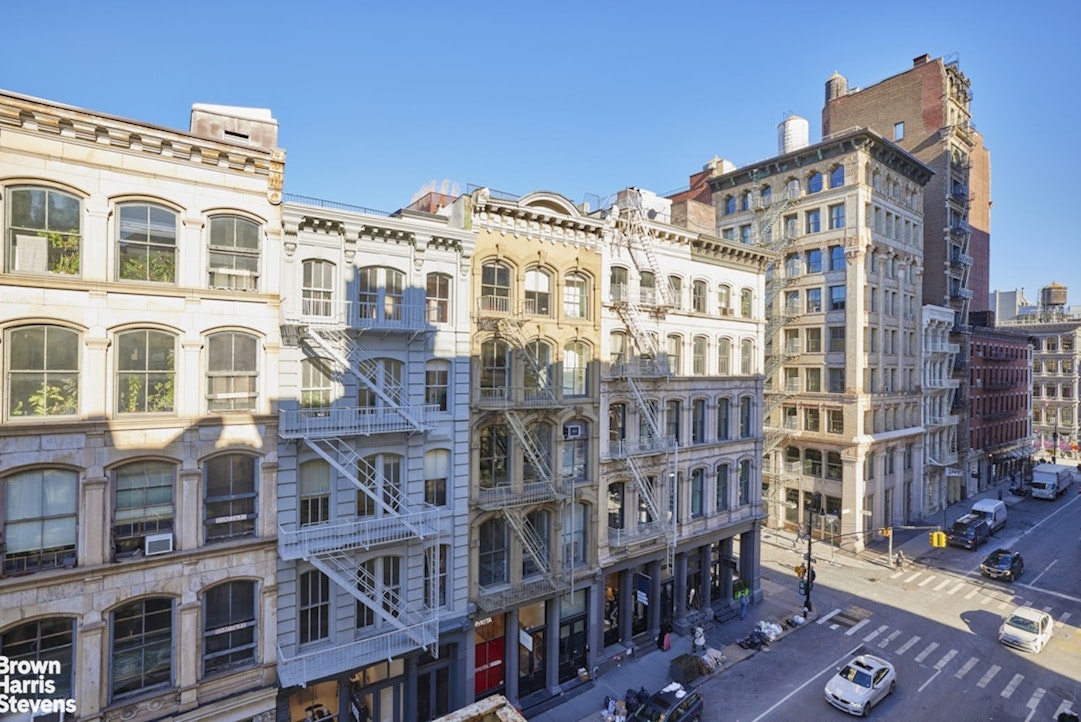 461 Broome Street, Unit 4 Manhattan, NY 10013 - Photo 13 of 14 a front view of a building with glass windows