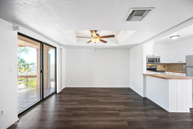a view of kitchen with wooden floor and a window