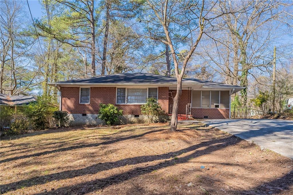 187 Fairburn Road Southwest Atlanta, GA 30331 - Photo 1 of 1 a front view of a house with yard outdoor seating and barbeque oven