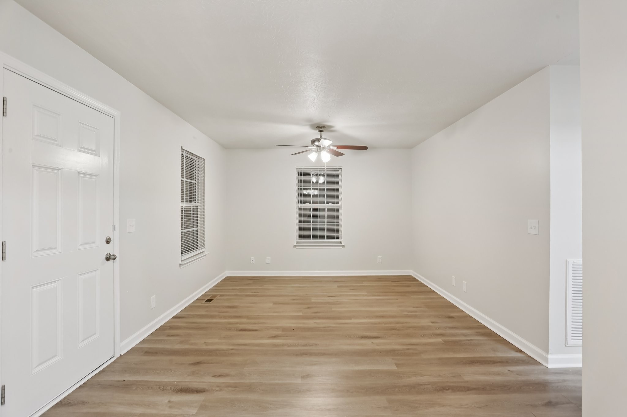 2607 Landrum Court Springfield, TN 37172 - Photo 13 of 37 a view of an empty room with wooden floor and a window
