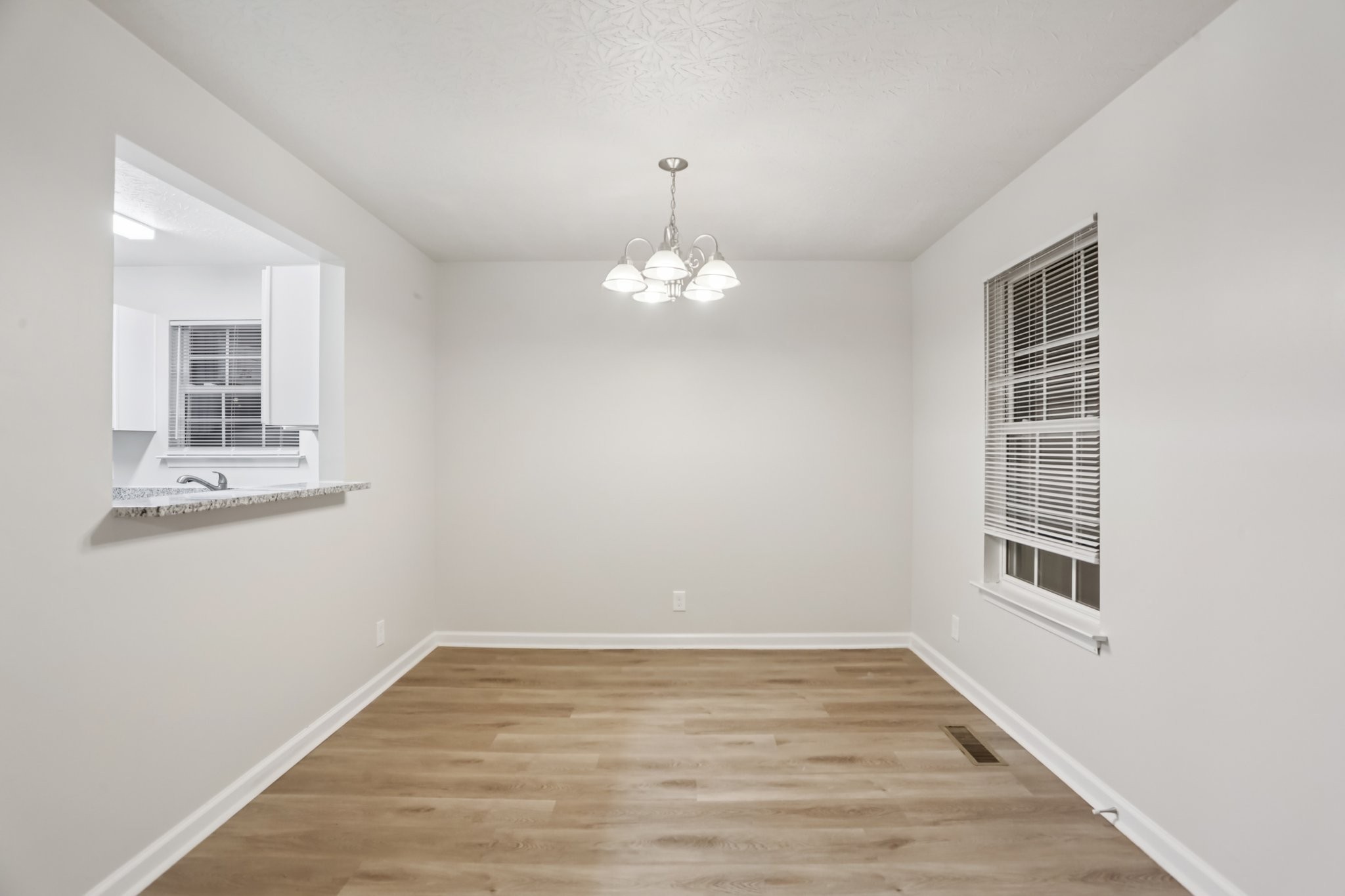2607 Landrum Court Springfield, TN 37172 - Photo 20 of 37 a view of an empty room with wooden floor and a window