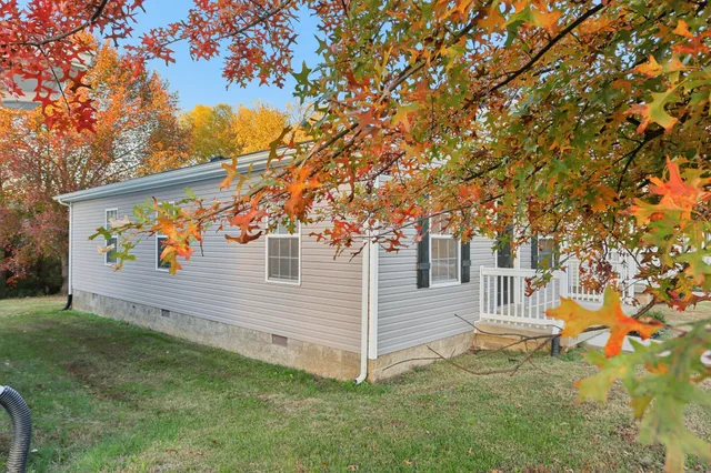 a view of a garage with a tree