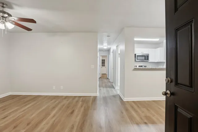 a view of a kitchen from the hallway