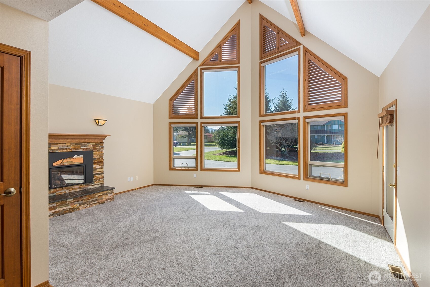 81 Bon Jon View Way Sequim, WA 98382 - Photo 13 of 38 a view of an empty room with a window and brick walls