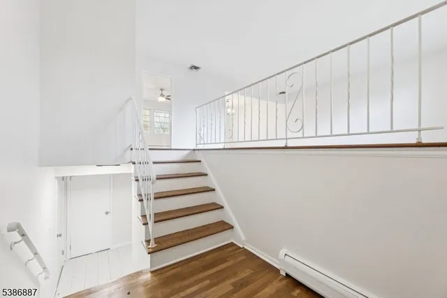 a view of a kitchen with wooden floor