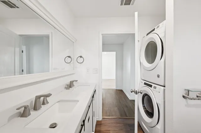 a utility room with sink dryer and washer