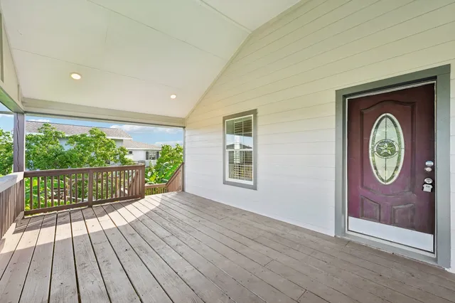 a view of an entryway with wooden floor
