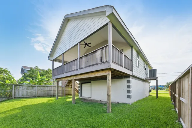 a view of a house with a yard and a large window