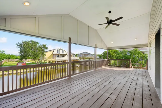a view of a balcony with wooden floor