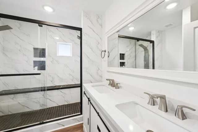 a bathroom with a sink and mirror