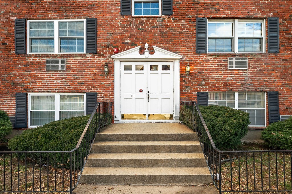 217 Neponset Avenue, Unit 33 Boston, MA 02122 - Photo 1 of 12 a front view of a house with a window and potted plants
