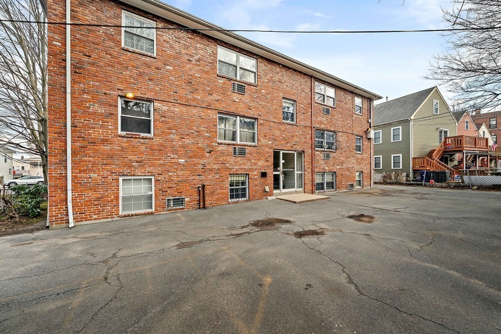 217 Neponset Avenue, Unit 33 Boston, MA 02122 - Photo 11 of 12 a view of a building with a street
