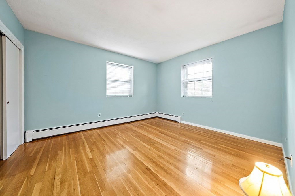 217 Neponset Avenue, Unit 33 Boston, MA 02122 - Photo 6 of 12 a view of empty room with wooden floor