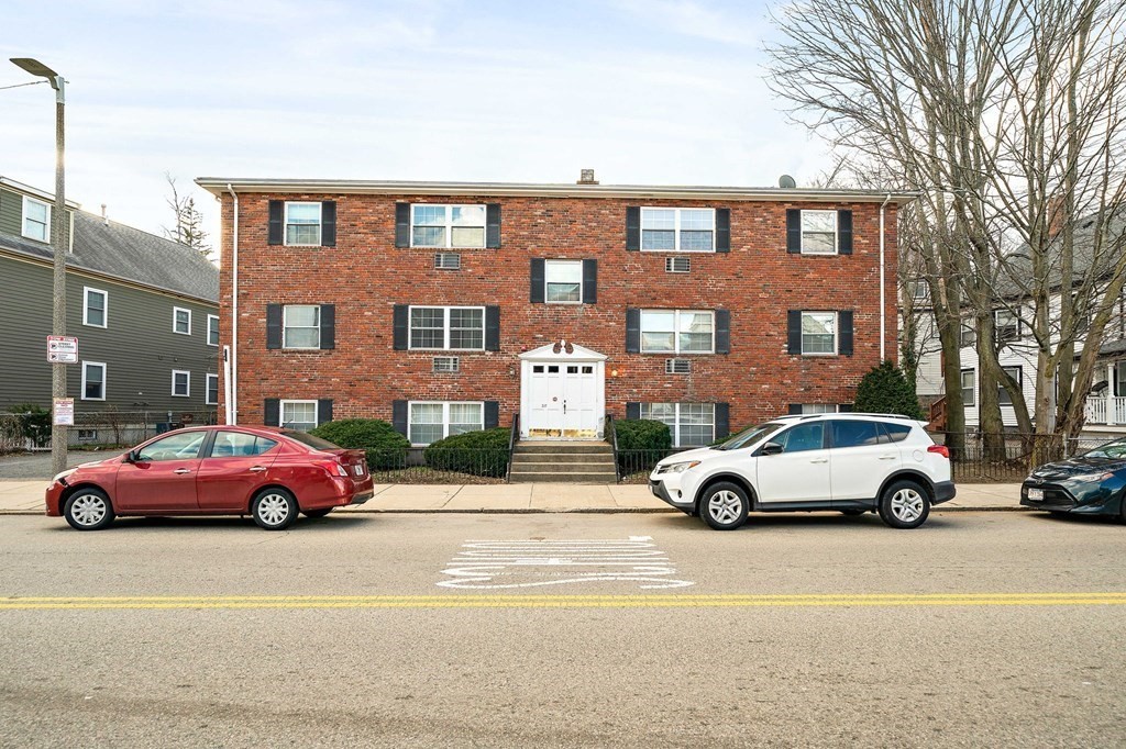 217 Neponset Avenue, Unit 33 Boston, MA 02122 - Photo 10 of 12 a car parked in front of a building