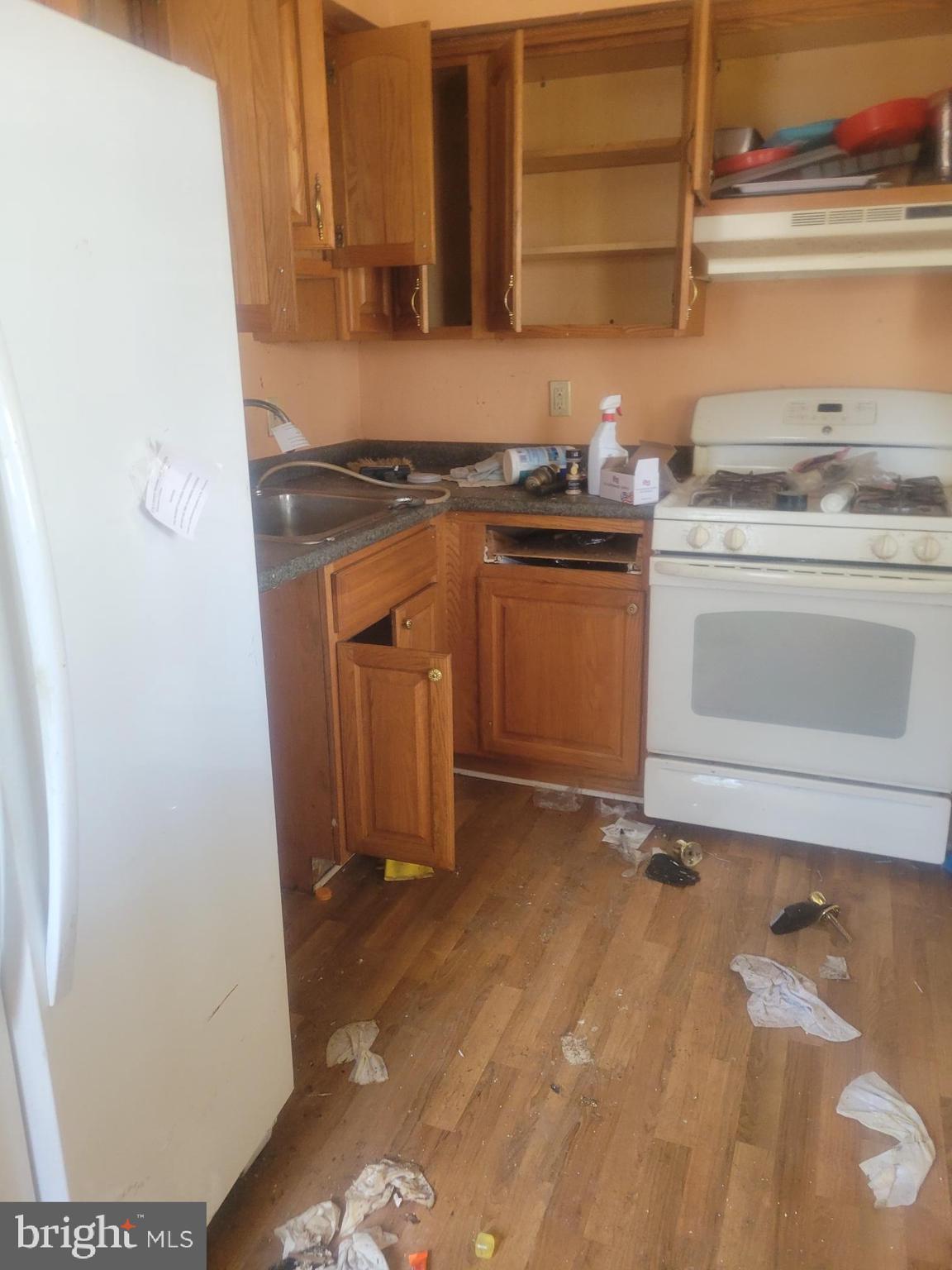623 Kingston Road Baltimore, MD 21220 - Photo 6 of 6 a kitchen with a stove and a cabinet
