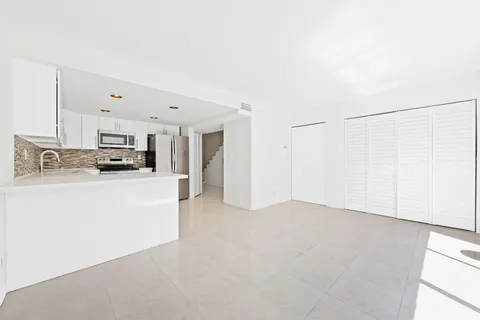 a view of a kitchen with electric appliances